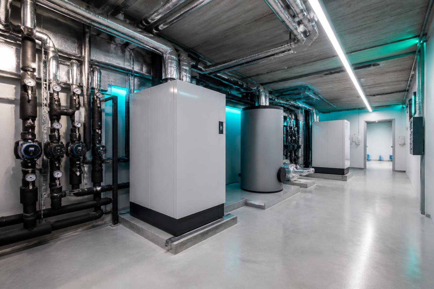 Energy-efficient hot water heating equipment installed in a modern plant room